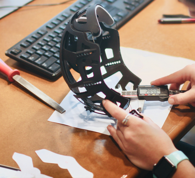 Measuring a product with digital calipers during a quality inspection